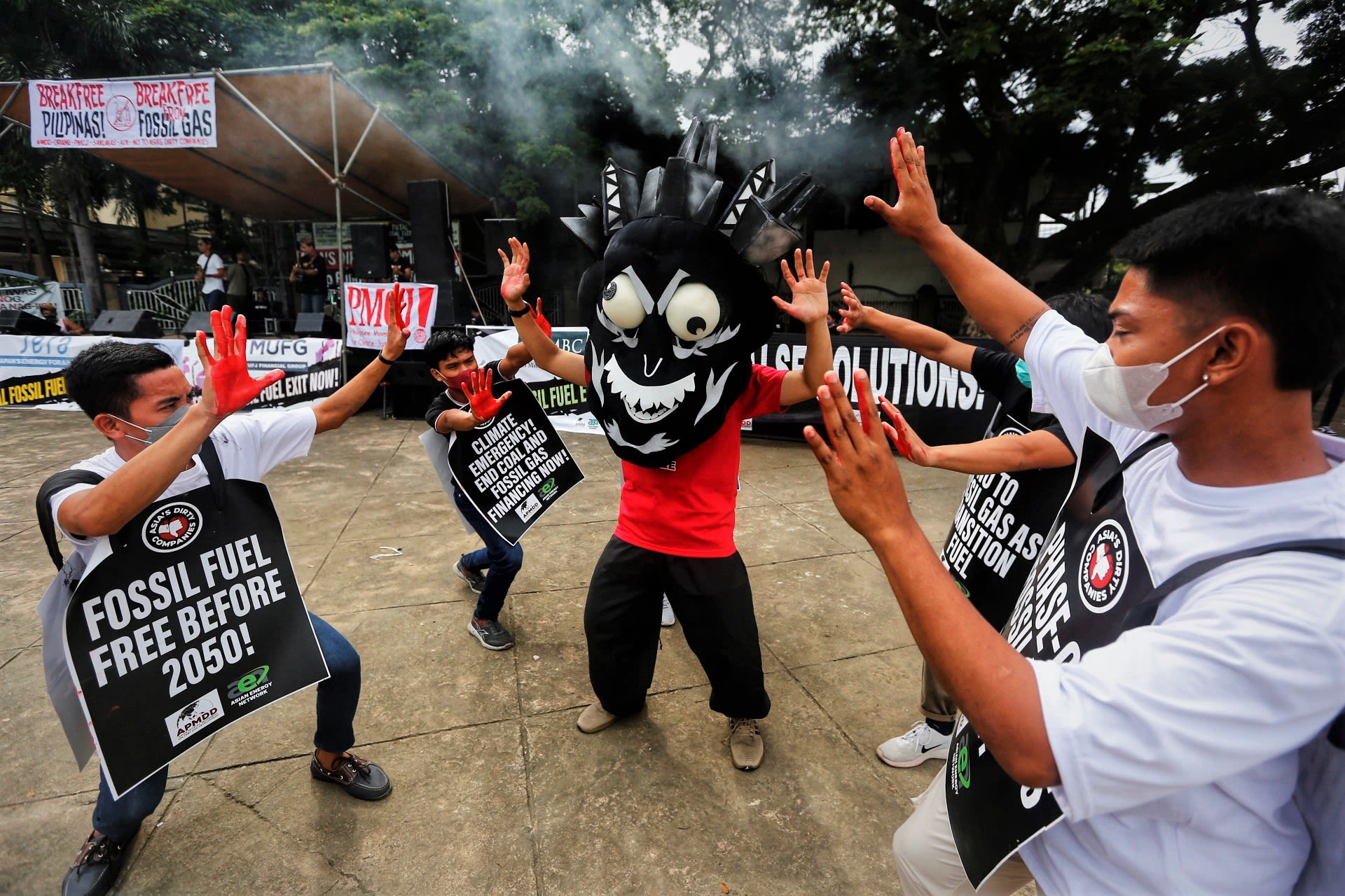 Protesters confront Yakee, the "monster" representing Asia's Dirty Energy Corporations. (Photo by Jimmy A Domingo)